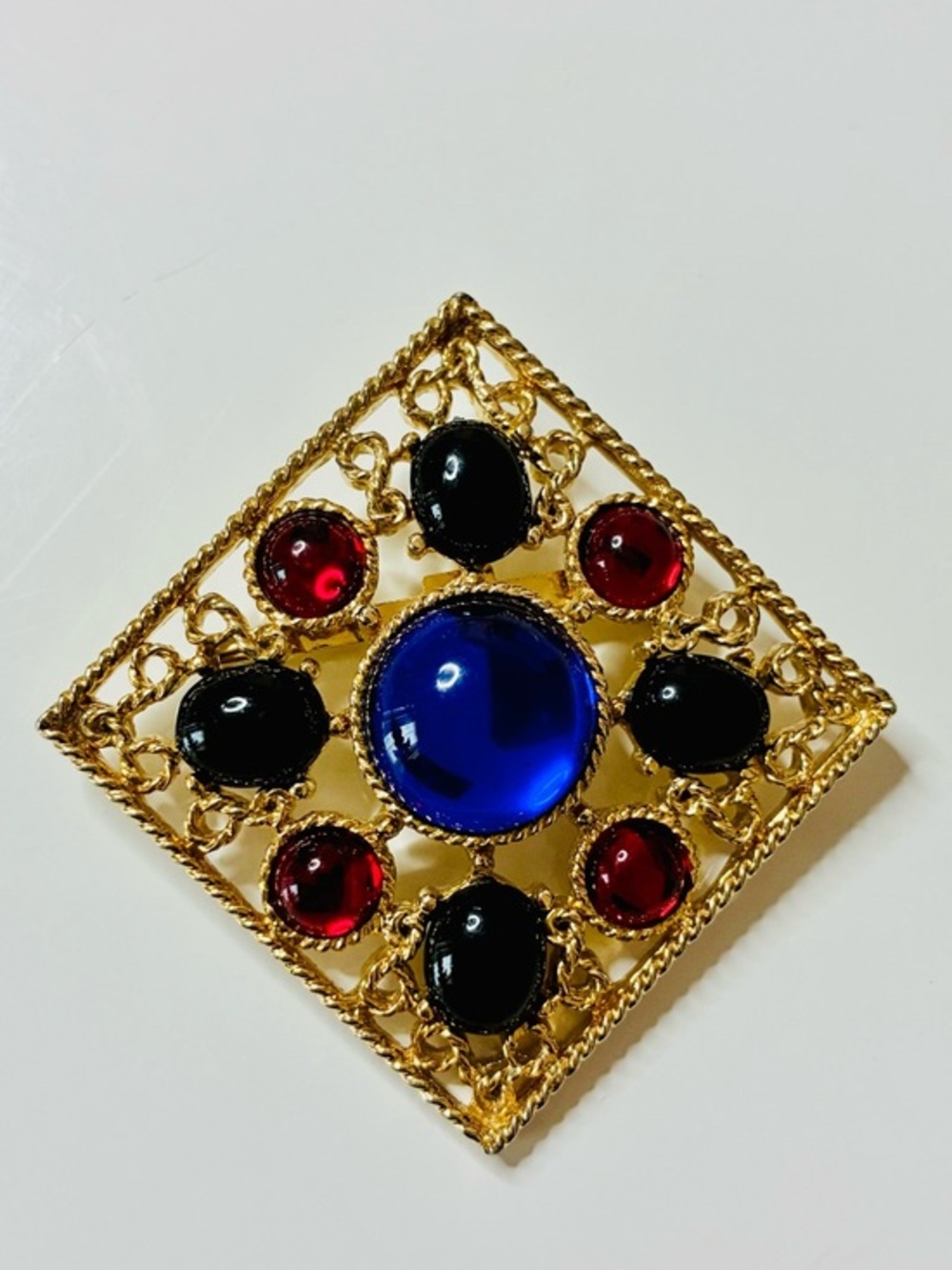 Bold Gold-Tone Brooch with Royal Blue Center and Black & Red Accents